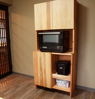 Shelves with microwave ovens and electric kettles